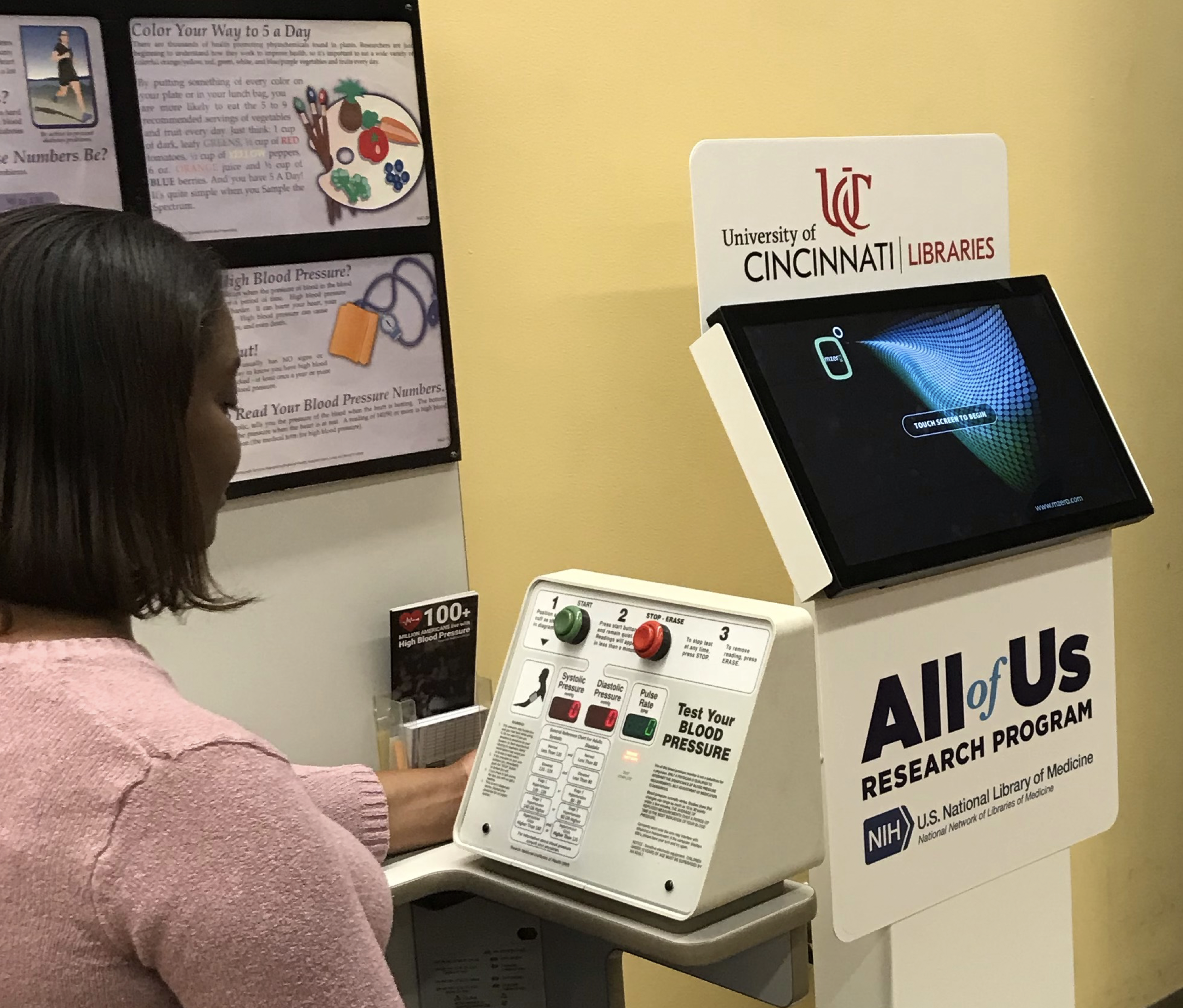 A woman testing her blood pressure.